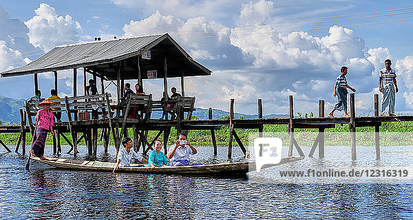 Maing Thauk township; Inle Lake  Shan state  Myanmar (Burma)  Asia ; Stilt houses ; stands in the water; The Raised Walkway Near The Village of Maing Thauk on The Way To The Weekly Market