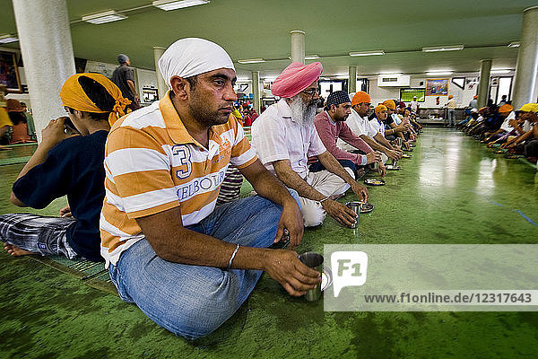 Lunch time in the temple Sikh community Sikhdharma Gurdwara Singh Sabha Association Novellara Reggio Emilia province Italy