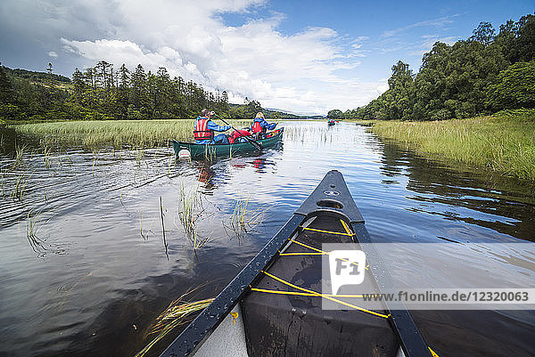 Canoeing Loch Oich  along the Caledonian Canal  near Fort William  Scottish Highlands  Scotland  United Kingdom  Europe