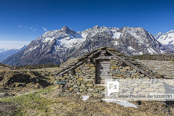 Stone hut Entova Alp Malenco Valley province of Sondrio Valtellina Lombardy Italy Europe