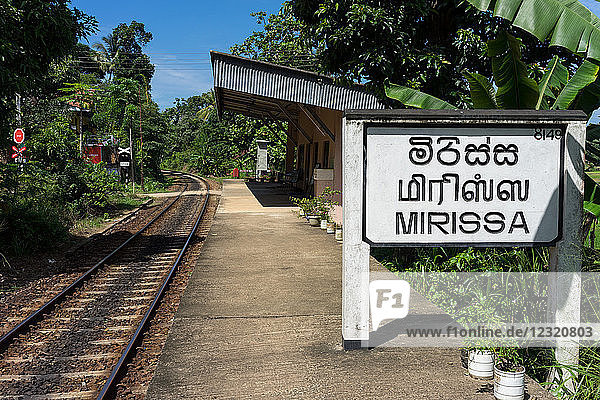 Platform sign and tracks at Mirissa train station in the south of Sri Lanka  Asia
