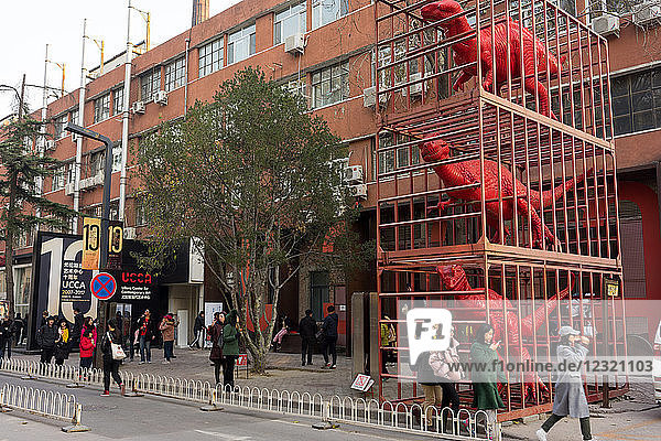 Red dinosaurs sculpture by Sui Jianguo in Dashanzi Art District  Beijing  China  Asia
