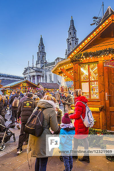 View of visitors and Christmas Market stalls at Christmas Market  Millennium Square  Leeds  Yorkshire  England  United Kingdom  Europe