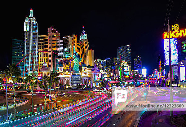 Colourful lights illuminate Las Vegas architecture and roadways at night; Las Vegas  Nevada  United States of America
