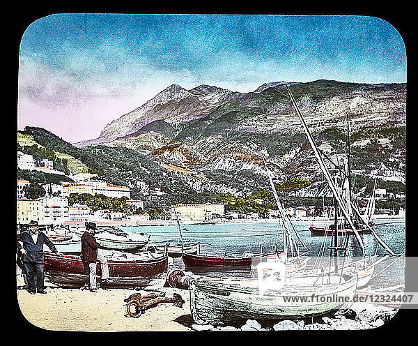 Magic Lantern slide circa 1900. Victorian or Edwardian era. The origional monchrome ( black and white ) photograph hand coloured.The photograph is the work of G.W. Wilson photographer and slide manufacturer 1823-1893.George Washington Wilson (7 February 1823 – 9 March 1893) was a pioneering Scottish photographer. The French Riviera and Monte Carlo (lecture ) . Slide 67 the Harbour at Menton Monte Carlo