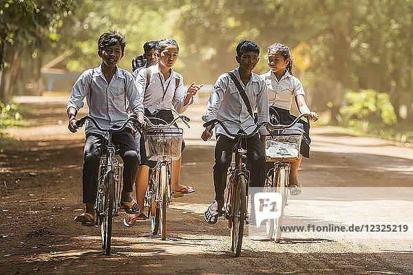 Cambodian school children on bicycles; Sambor Prei Kuk  Kompong Thom  Cambodia
