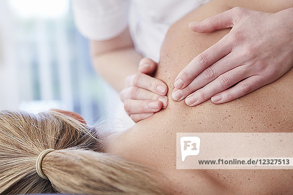Woman receiving shoulder massage