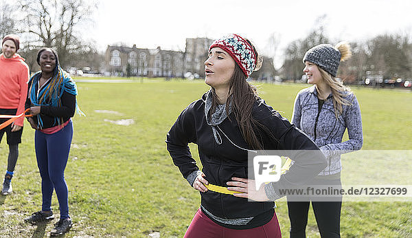 Women exercising in park