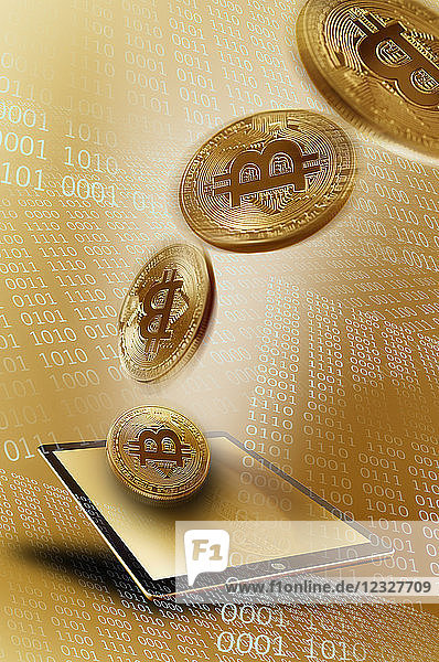 Golden Bitcoins over digital tablet