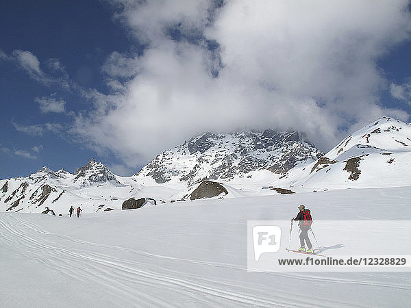 AUSTRIA  Tyrol  Silvretta mountain range  cross-country skiers are hiking towards the Larainfernerspitze