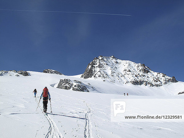AUSTRIA  Tyrol  Silvretta mountain range some cross-country skiers are hiking towards the Jamtal Joch pass