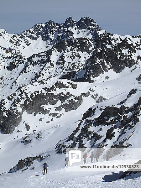 AUSTRIA  Tirol  Silvretta mountain range  a group of snowshoe hikers at Jamtal Joch pass