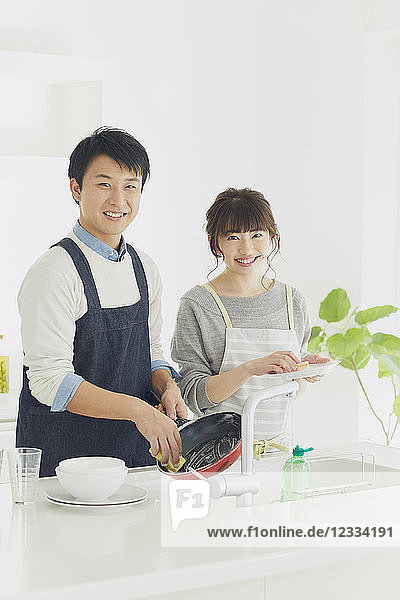 Japanese couple cooking in the kitchen