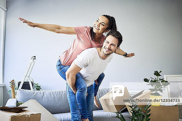 Carefree couple moving into new home
