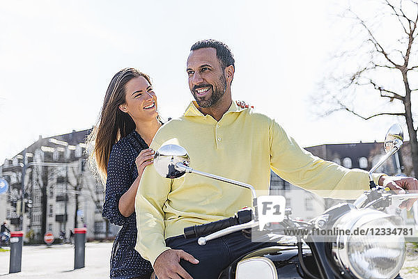 Happy couple on a motorbike