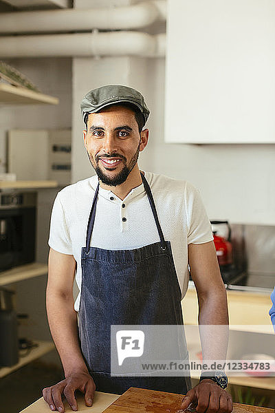 Portrait of smiling man in kitchen