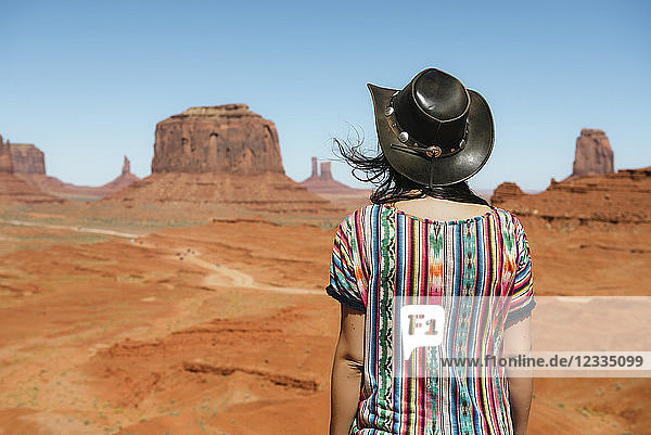 USA Utah Woman with cowboy hat enjoying the views in Monument Valley