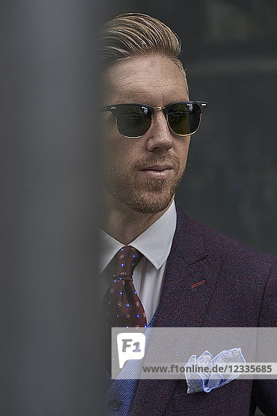 Portrait of fashion blogger Steve Tilbrook wearing sunglasses and dress handkerchief