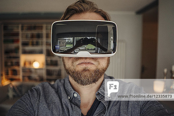 Mature man taking selfie of himself  wearing VR glasses  looking cool