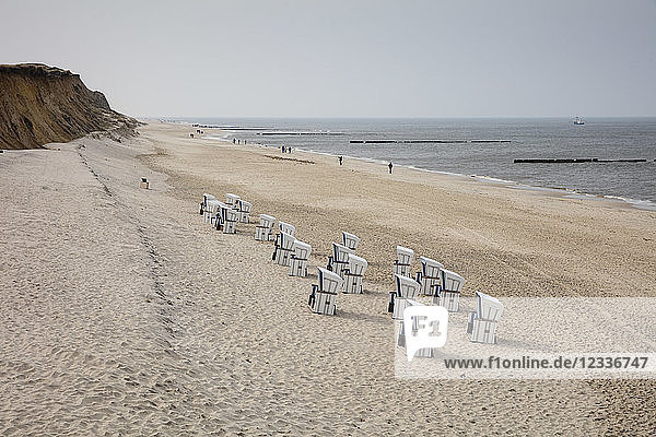 Germany Schleswig-Holstein Sylt beach and empty hooded beach chairs