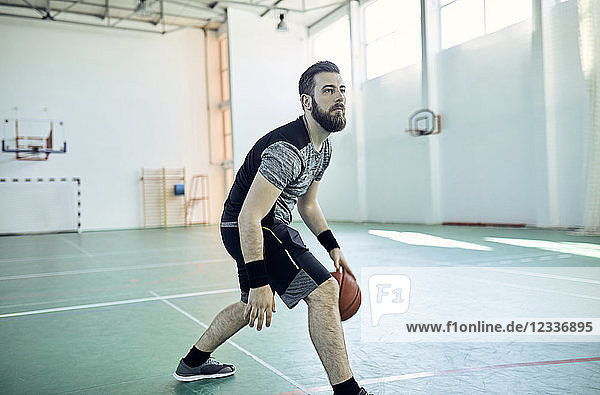 Man playing basketball  indoor