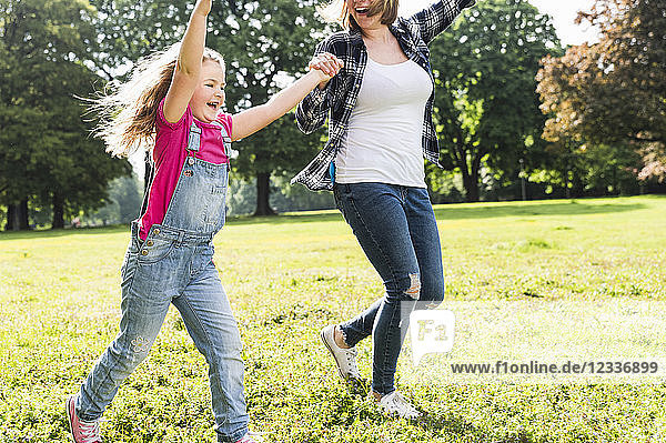 Happy mother with daughter in a park