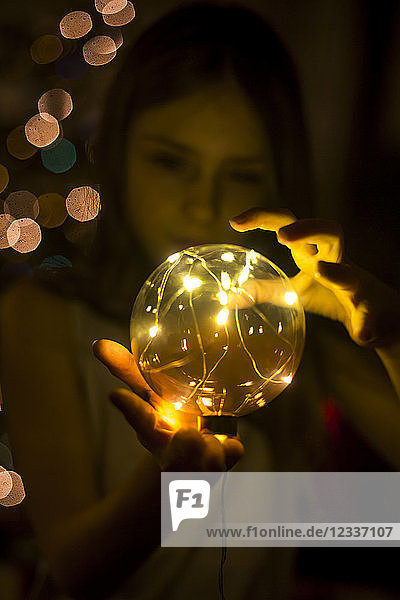 Girl with shining crystal ball