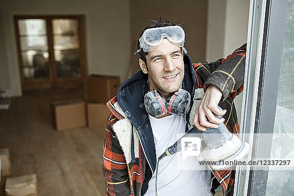 Portrait of a handyman renovating flat