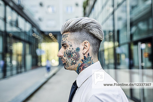 Young businessman with tattooed face  portrait