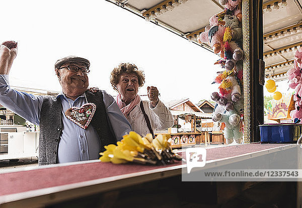Senior couple having fun on fair