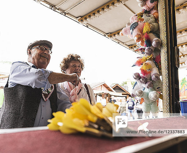 Senior couple having fun on fair