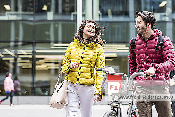 UK  London  young couple with rental bicycle from bike share stand