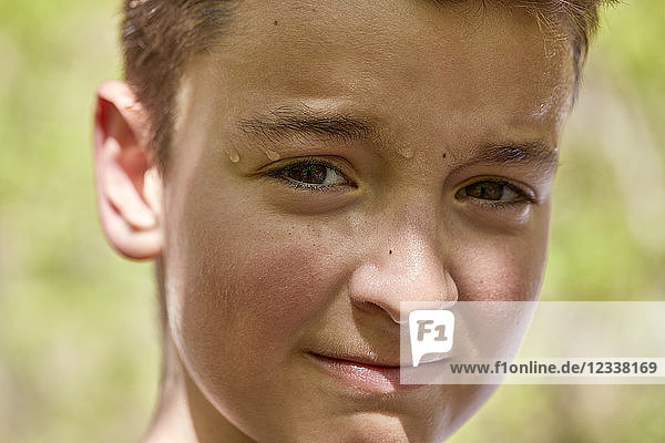 Portrait of sweating boy outdoors