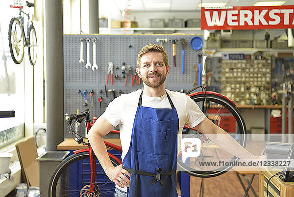 Bicycle mechanic in his repair shop  portrait