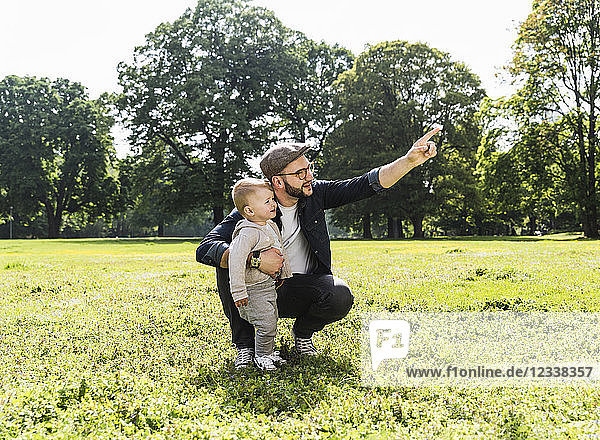 Father talking to son in a park