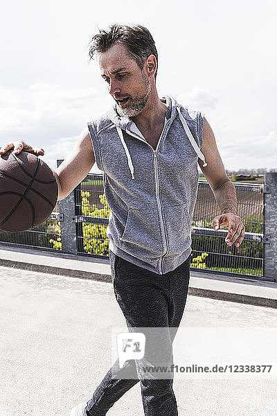 Man dribbling with basket ball