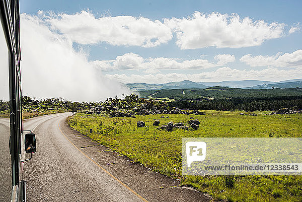 Landscape view from rural highway with low cloud over valley  South Africa