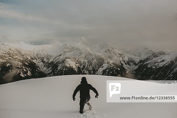 Man in deep snow on mountain Abbotsford Canada
