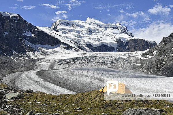 Camping on the ridge of moraine close to the Grand Combin glacier Grand Combin on background Switzerland Swiss.
