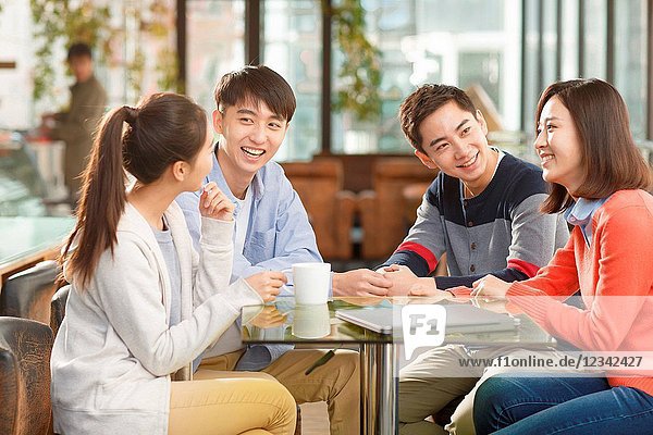 Young men and women in the coffee shop
