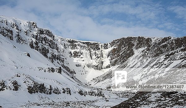 Hengifoss Waterfall snowy landscape with river Hengifossá near Vallanes Austurland East Iceland Iceland Europe