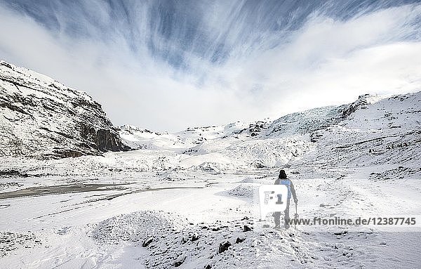 Hiker with ice pick on the glacier  Skaftafellsjökull Glacier  Vatnajokull National Park  South Iceland  IcelandSouth Iceland  Iceland  Europe