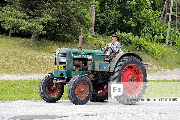 Bolinder-Munktell tractor and driver on Kimito Traktorkavalkad  Tractor Cavalcade. BM was bought by AB Volvo in 1950. Kimito  Finland - July 7  2018.