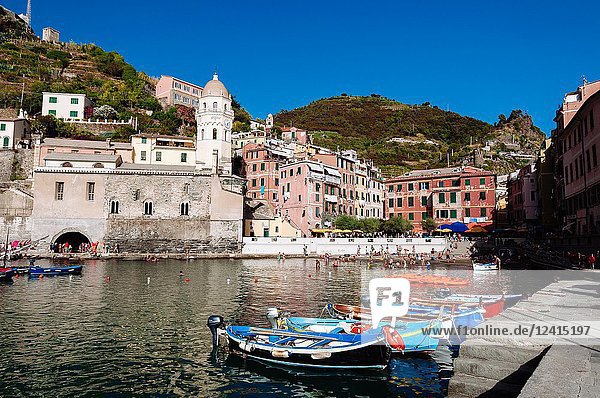 Fishing boats in harbour and tourists on the little beach  Vernazza  Italian Riviera  Liguria  Italy.