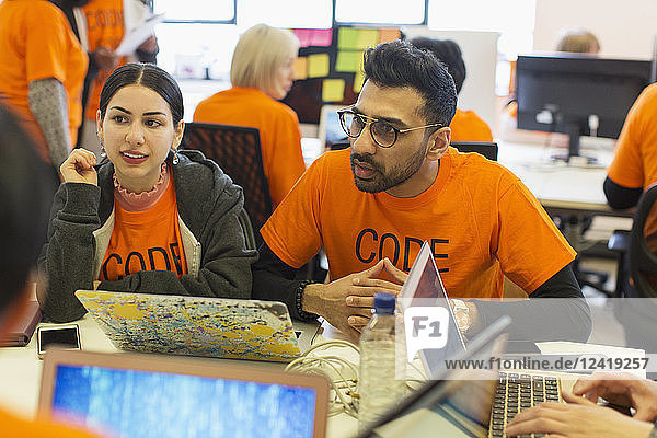 Hackers coding for charity at hackathon