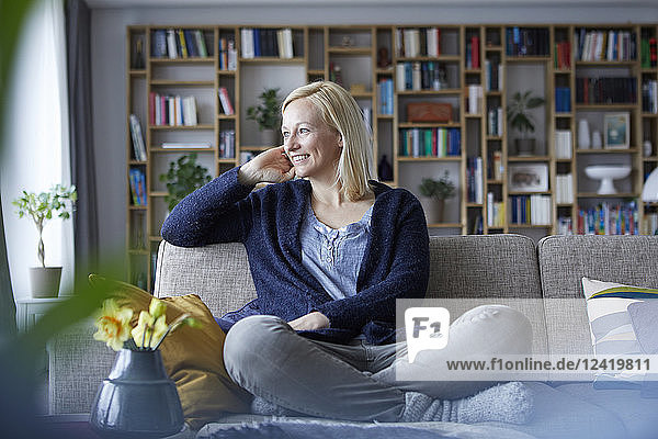 Woman relaxing at home  sitting on couch