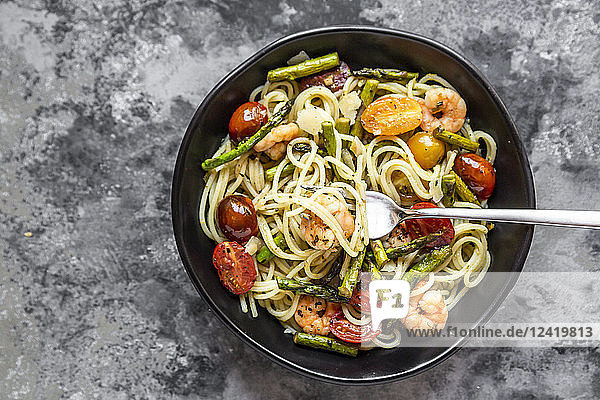 spaghetti with shrimps  green asparagus  tomato  pesto and parmesan