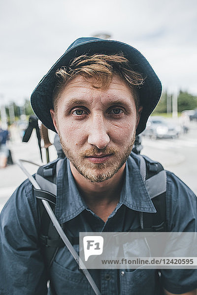 Portrait of backpacker with hat  travelling the Lofoten