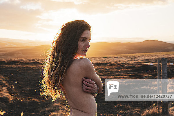 Iceland  naked young woman at sunset