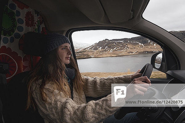 Iceland  young woman driving van